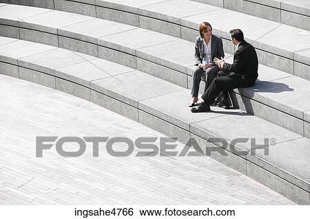 Businesspeople having discussion View Large Photo Image Stock Photograph - Businesspeople having discussion . Fotosearch