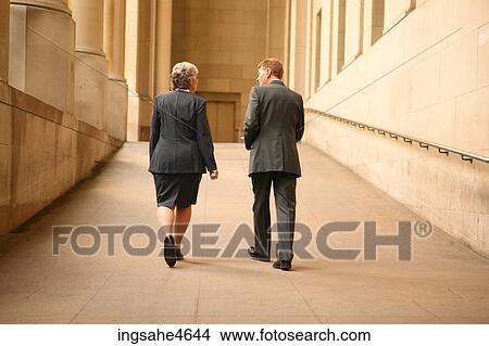 Businesspeople in conversation View Large Photo Image Picture - Businesspeople in conversation . Fotosearch