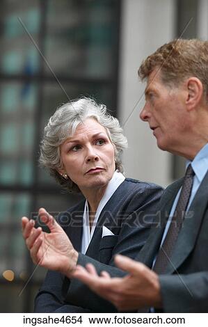 Businesspeople in conversation View Large Photo Image Picture - Businesspeople in conversation. Fotosearch