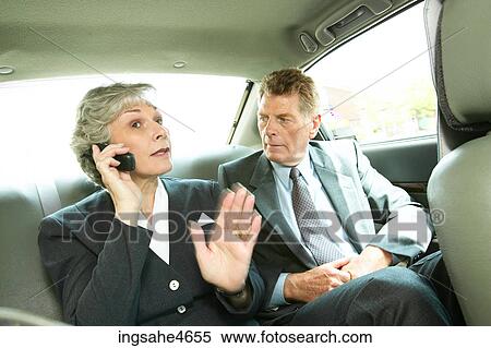 Businesspeople in taxi View Large Photo Image Stock Photography - Businesspeople in taxi. Fotosearch