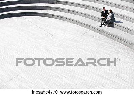 Businesspeople sitting on stairs View Large Photo Image Stock Image - Businesspeople sitting on stairs . Fotosearch
