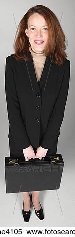 Businesswoman in black suit holding briefcase View Large Photo Image Stock Photography - Businesswoman in black suit holding briefcase. Fotosearch