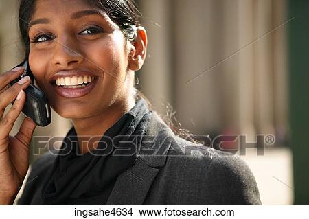 Businesswoman on cell phone View Large Photo Image Picture - Businesswoman on cell phone . Fotosearch