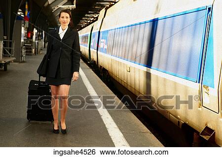 Stock Photograph - Businesswoman on train platform . Fotosearch