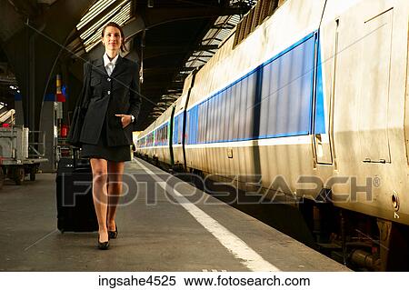 Businesswoman on train platform View Large Photo Image Stock Photography - Businesswoman on train platform . Fotosearch