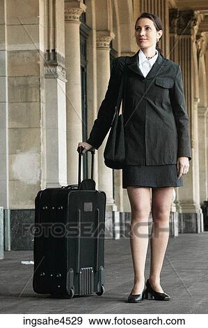 Stock Photo - Businesswoman with suitcase . Fotosearch