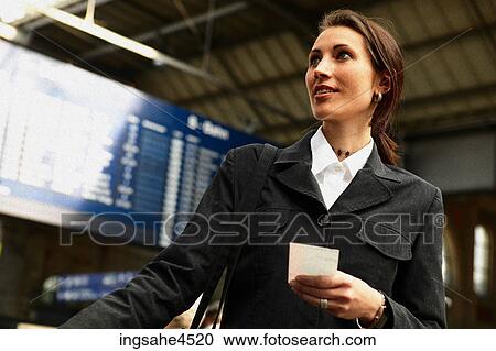 Stock Image - Businesswoman with ticket . Fotosearch