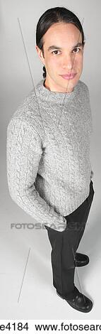 Casual man standing in gray sweater View Large Photo Image Picture - Casual man standing in gray sweater. Fotosearch