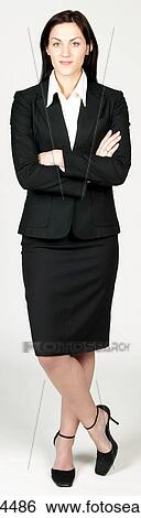 Confident businesswoman leaning on one leg View Large Photo Image Stock Photograph - Confident businesswoman leaning on one leg . Fotosearch