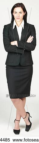 Confident businesswoman leaning on one leg View Large Photo Image Stock Photography - Confident businesswoman leaning on one leg. Fotosearch