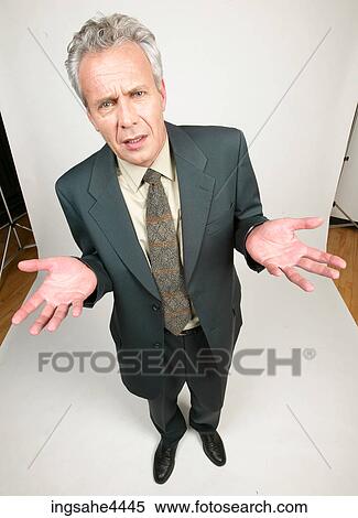 Confused businessman in black suit View Large Photo Image Stock Photography - Confused businessman in black suit. Fotosearch