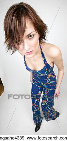 Stock Photo - Confused woman in blue outfit. Fotosearch