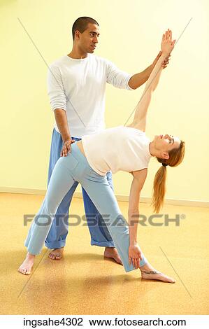 Couple sitting in butterfly pose while practicing partner yoga View Large Photo Image Stock Image - Couple sitting in butterfly pose while practicing partner yoga. Fotosearch