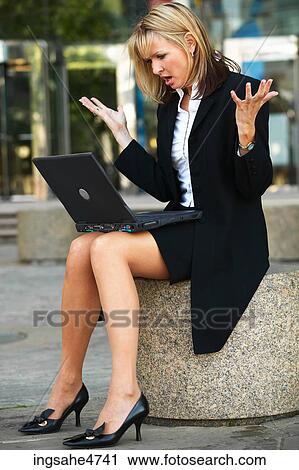 Frustrated businesswoman with laptop View Large Photo Image Stock Image - Frustrated businesswoman with laptop . Fotosearch