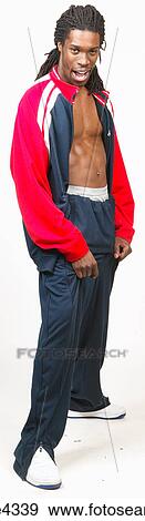 Grinning man in blue and red tracksuit View Large Photo Image Stock Photo - Grinning man in blue and red tracksuit. Fotosearch