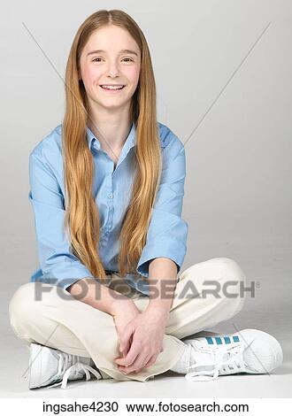 Stock Image - Grinning teenaged girl. Fotosearch