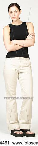 Stock Image - Irritated young woman in casual attire. Fotosearch