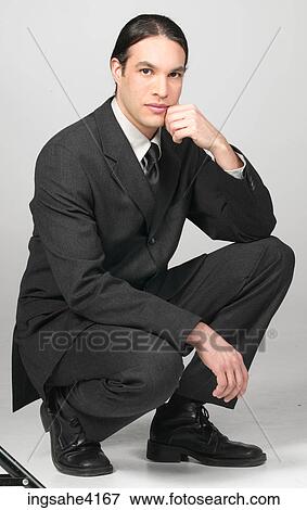 Kneeling and thinking businessman View Large Photo Image Stock Photo - Kneeling and thinking businessman. Fotosearch
