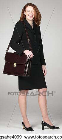 Laughing businesswoman in black suit View Large Photo Image Stock Photo - Laughing businesswoman in black suit. Fotosearch