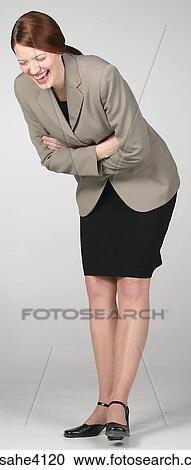 Laughing businesswoman in gray suit View Large Photo Image Stock Image - Laughing businesswoman in gray suit. Fotosearch