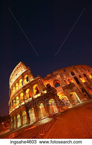 Lights on the Coliseum in Rome at night View Large Photo Image Stock Image - Lights on the Coliseum in Rome at night . Fotosearch