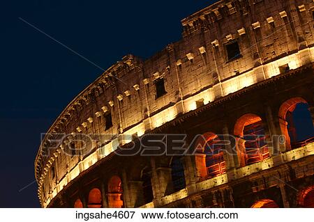 Stock Photo - Lights on the Coliseum in Rome at night . Fotosearch
