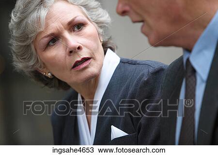 Stock Image - Listening businesswoman . Fotosearch