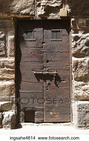 Locked heavy door in stone wall View Large Photo Image Picture - Locked heavy door in stone wall . Fotosearch
