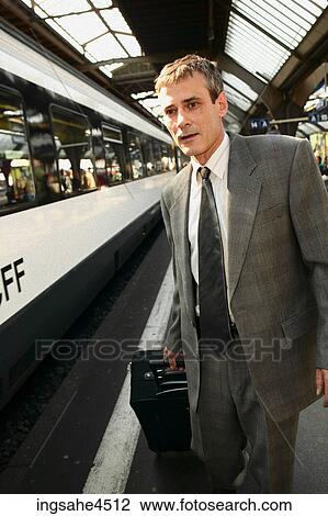 Man boarding train View Large Photo Image Stock Image - Man boarding train . Fotosearch