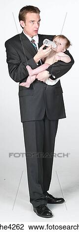 Man feeding baby View Large Photo Image Stock Image - Man feeding baby . Fotosearch
