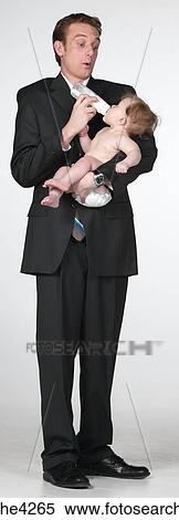Man feeding baby View Large Photo Image Stock Photography - Man feeding baby . Fotosearch
