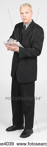 Man holding a clipboard View Large Photo Image Stock Photo - Man holding a clipboard . Fotosearch