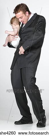 Man holding baby View Large Photo Image Stock Image - Man holding baby . Fotosearch
