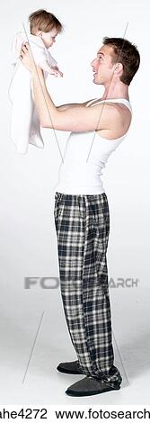 Man holding baby View Large Photo Image Stock Image - Man holding baby . Fotosearch
