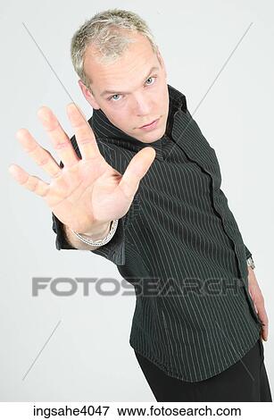Man holding his palm out View Large Photo Image Stock Photo - Man holding his palm out . Fotosearch