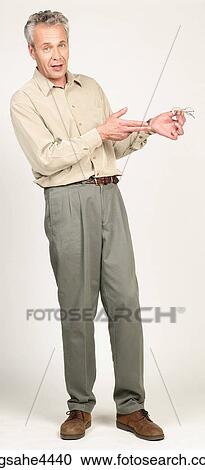 Man pointing to his eyeglasses View Large Photo Image Stock Image - Man pointing to his eyeglasses . Fotosearch