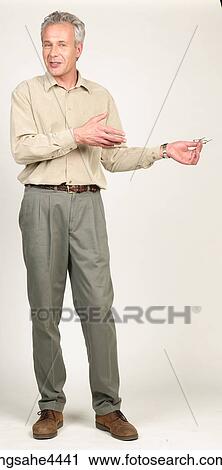 Man pointing to his eyeglasses View Large Photo Image Stock Image - Man pointing to his eyeglasses. Fotosearch