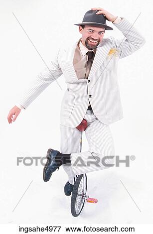 man riding unicycle View Large Photo Image Stock Photo - man riding unicycle . Fotosearch