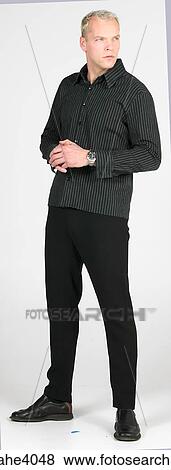 Man standing and gazing ahead View Large Photo Image Stock Photo - Man standing and gazing ahead . Fotosearch