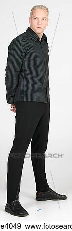 Man standing and gazing ahead View Large Photo Image Stock Photo - Man standing and gazing ahead . Fotosearch