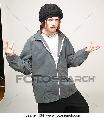 Man with dreadlocks and black hat posing with attitude View Large Photo Image Picture - Man with dreadlocks and black hat posing with attitude. Fotosearch