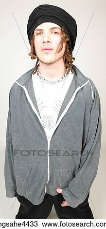 Man with dreadlocks and black hat standing with attitude View Large Photo Image Stock Image - Man with dreadlocks and black hat standing with attitude. Fotosearch
