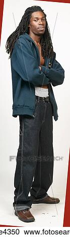 Man with dreadlocks in jeans and blue sweatshirt View Large Photo Image Stock Image - Man with dreadlocks in jeans and blue sweatshirt. Fotosearch