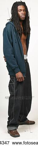 Man with dreadlocks in jeans and blue sweatshirt View Large Photo Image Stock Photo - Man with dreadlocks in jeans and blue sweatshirt . Fotosearch