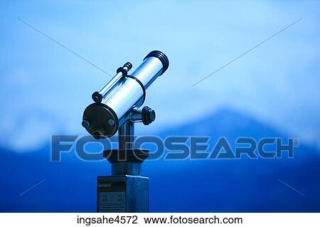 Metal telescope pointing at mountain landscape View Large Photo Image Stock Image - Metal telescope pointing at mountain landscape . Fotosearch