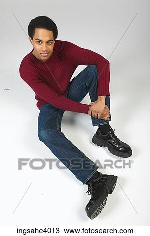 Relaxed man in jeans and sweater View Large Photo Image Stock Image - Relaxed man in jeans and sweater. Fotosearch