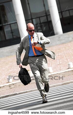 Running businessman View Large Photo Image Stock Photo - Running businessman . Fotosearch
