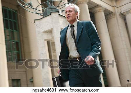 Rushing businessman View Large Photo Image Stock Image - Rushing businessman. Fotosearch