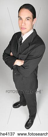 Serious businessman in gray suit View Large Photo Image Stock Photo - Serious businessman in gray suit . Fotosearch