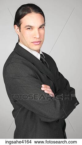 Serious businessman with crossed arms View Large Photo Image Picture - Serious businessman with crossed arms . Fotosearch